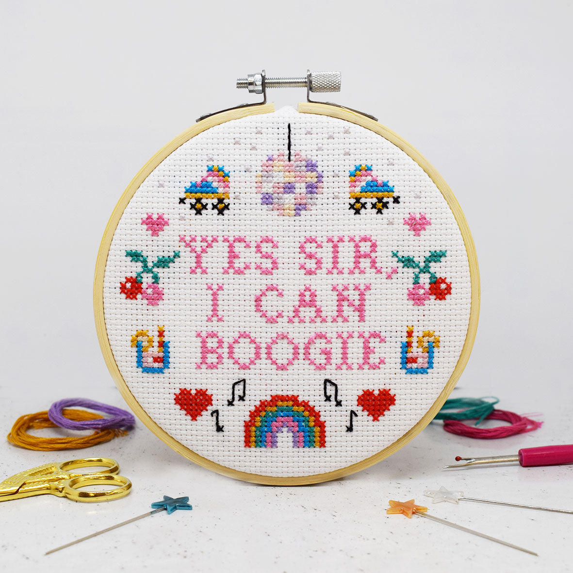 cross stitch design with boogie slogan and disco themed motifs