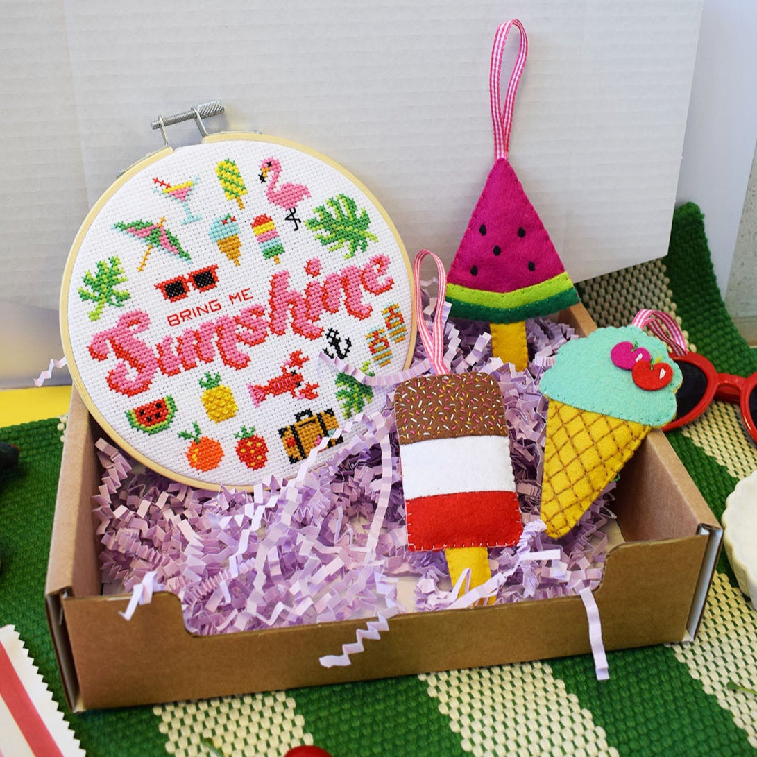 cute craft box that includes a felt lolly craft kit and 'bring me sunshine' cross stitch hoop.