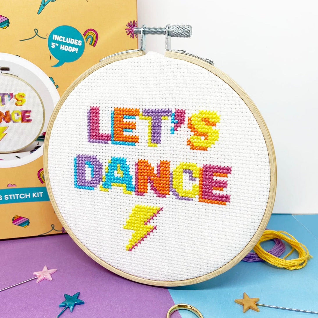 cross stitch design with let's dance slogan and lightening belt