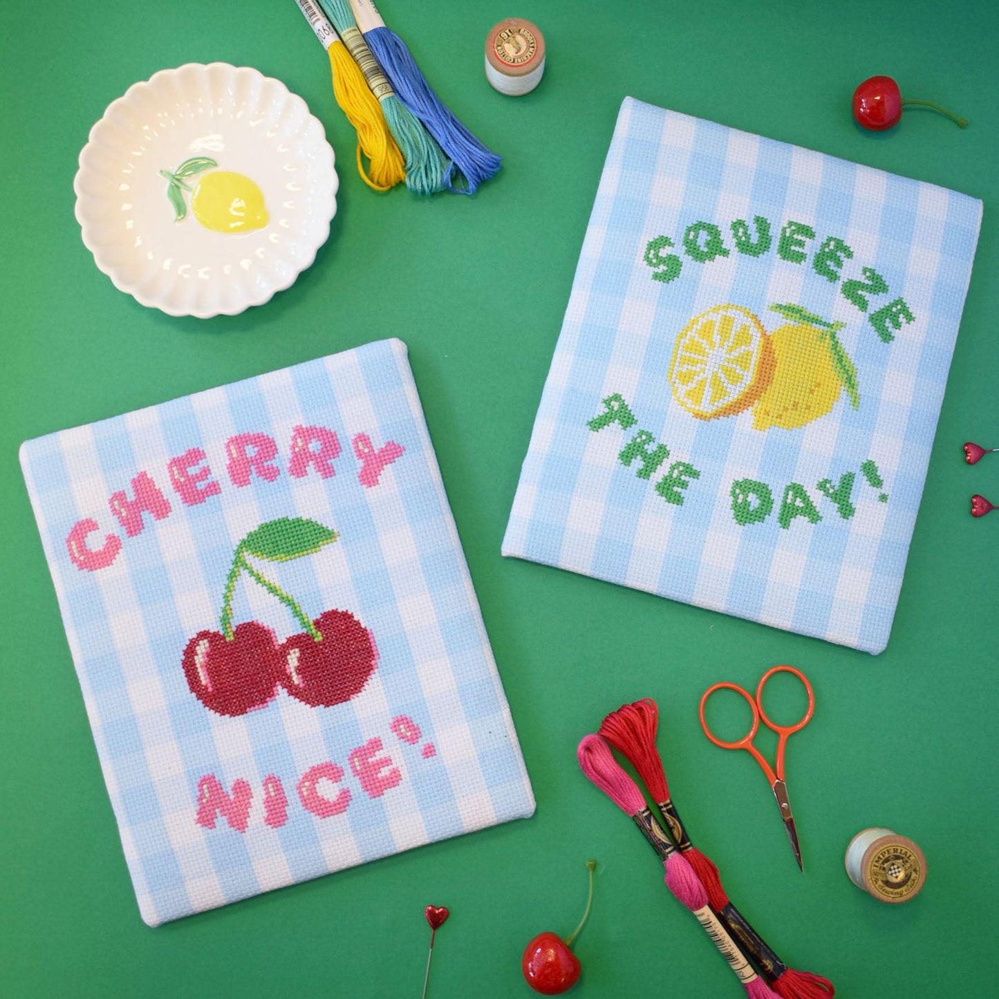 set of gingham cross stitch kits with a lemon or cherry motifs.