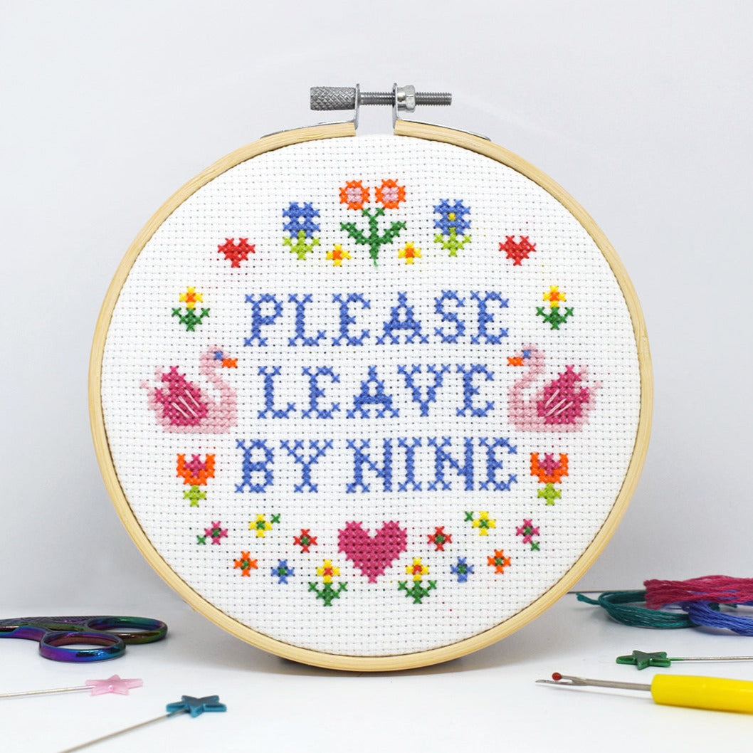 cross stitch design with please leave by nine slogan and floral motifs