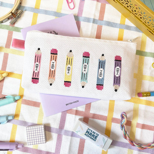 cross stitch Pencil case with stationery items on a checkered tablecloth