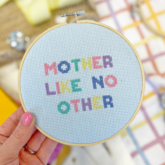 a hoop with 'mother like no other 'cross stitch design