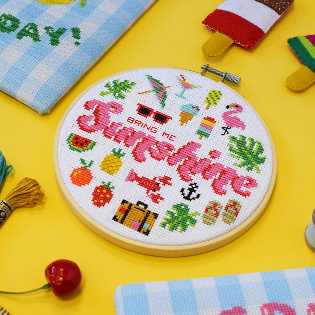 Bring Me Sunshine cross stitch kit with 6-inch hoop, colourful threads, Aida fabric, on a sunny bright yellow background with cute cherries